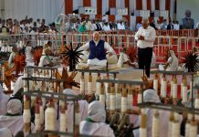 ndia's Prime Minister Narendra Modi spins cotton on a wheel, in Ahmedabad