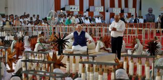 ndia's Prime Minister Narendra Modi spins cotton on a wheel, in Ahmedabad
