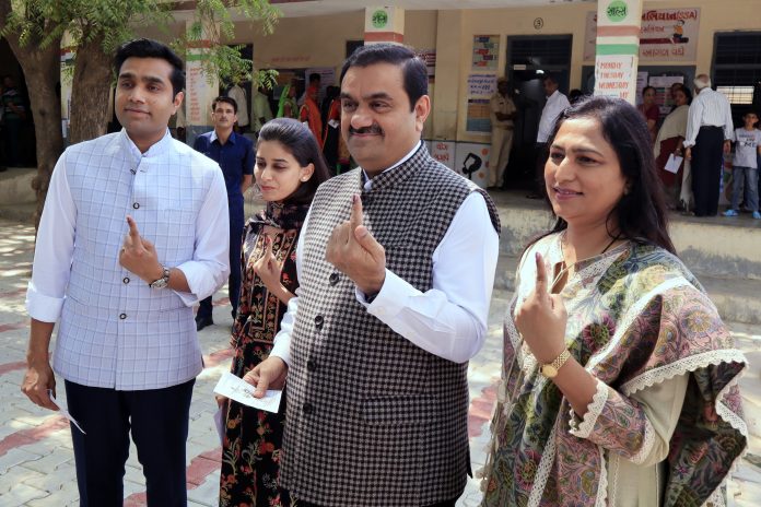 Adani industries founder Gautam Adani with wife Priti Adani and son Karan Adani s