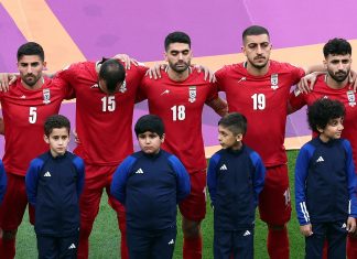 Iran players refuse to sing national anthem at football world cup