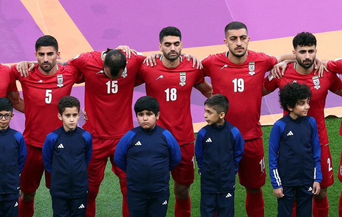 Iran players refuse to sing national anthem at football world cup