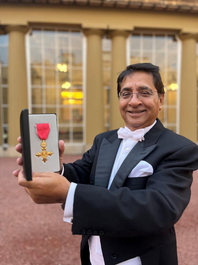 The Indian-origin charity worker was honored at Buckingham Palace