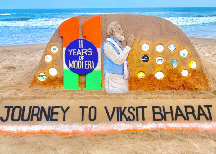 Sudarshan Patnaik creates a sand art on the completion of 11 years of the PM Modi's Government