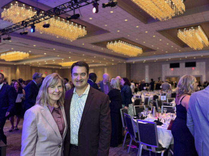 Melissa Hortman, a former assembly speaker and her husband, Mark, pose for a photograph at the annual Humphrey-Mondale Dinner in Minneapolis