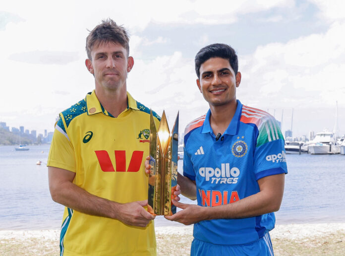 Shubman Gill and Mitchell Marsh pose for a picture with the trophy on the eve of their first ODI