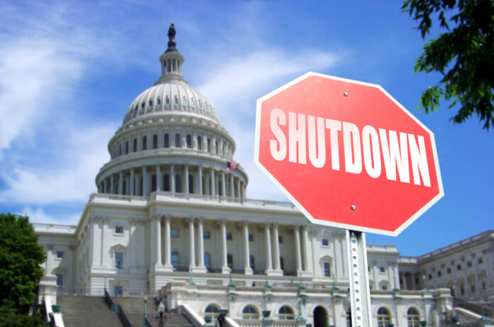 Government Shutdown concept: Stop sign in front of US Capital Building Concept