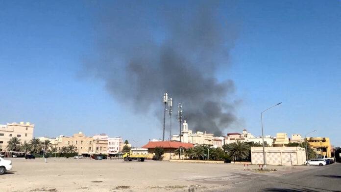Smoke rises from an area surrounding U.S. Embassy, in Bayan