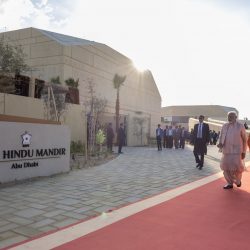 Brahmaviharidas Swami taking PM Narendra Modi on a tour of the BAPS Hindu Mandir campus_2-min